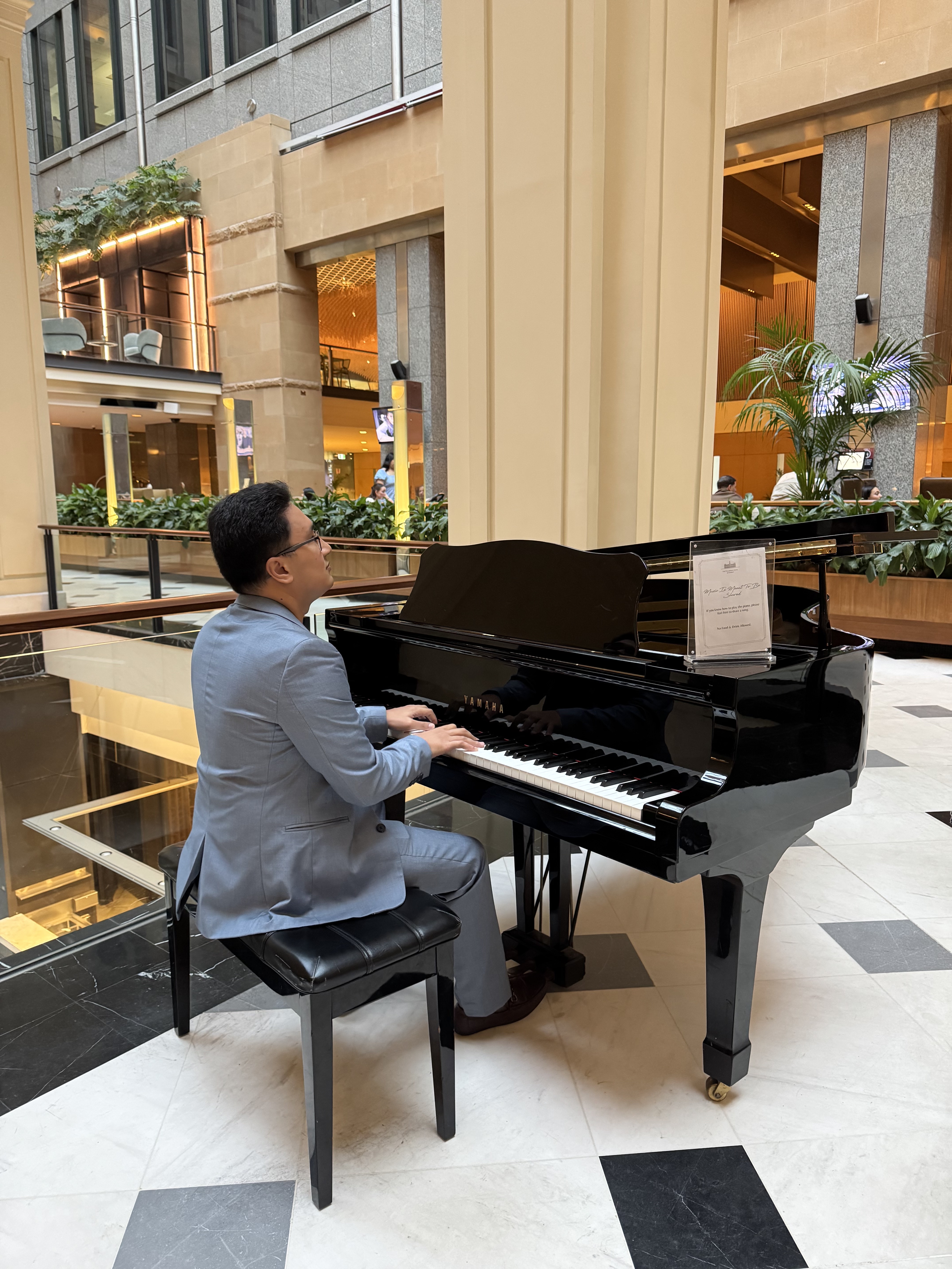 Claro playing grand piano at Fullerton Hotel Sydney